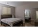 Cozy bedroom featuring a large window and mirrored closet providing ample storage at 11244 Gammila Dr, Las Vegas, NV 89141