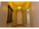 Welcoming foyer with decorative lighting fixture, arched doorway, and elegant water feature at 11244 Gammila Dr, Las Vegas, NV 89141