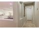 Hallway entrance offers open view to the living spaces, neutral walls, and tile flooring at 11244 Gammila Dr, Las Vegas, NV 89141