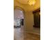 Inviting entryway with a decorative wall fountain and arched doorway to the living area at 11244 Gammila Dr, Las Vegas, NV 89141