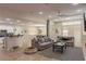 Open concept living room with tile floors and lots of natural light at 11244 Gammila Dr, Las Vegas, NV 89141