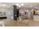 Spacious living room with tile floors, neutral paint, and an open floor plan at 11244 Gammila Dr, Las Vegas, NV 89141