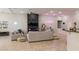 Spacious living room with tile floors, a decorative fireplace and an open layout at 11244 Gammila Dr, Las Vegas, NV 89141