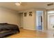 Large main bedroom with ceiling fan, wood floors, and entry to main bathroom and closet at 11244 Gammila Dr, Las Vegas, NV 89141
