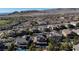 Panoramic aerial shot of a residential neighborhood with houses, mountains, and community landscaping at 12124 Kite Hill Ln, Las Vegas, NV 89138