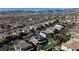 Expansive aerial perspective of a community with houses and scenic mountain backdrop under a clear sky at 12124 Kite Hill Ln, Las Vegas, NV 89138