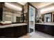 This bathroom features a dual sink vanity with marble counters, and access to a walk-in closet at 12124 Kite Hill Ln, Las Vegas, NV 89138