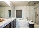 This bathroom offers white subway tile, a soaking tub, and a glass walk-in shower at 12124 Kite Hill Ln, Las Vegas, NV 89138