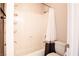 Bathroom with a shower-tub combo and a neutral-toned shower curtain at 12124 Kite Hill Ln, Las Vegas, NV 89138