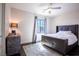 Stylish bedroom featuring a ceiling fan, gray accents, and natural light from the window at 12124 Kite Hill Ln, Las Vegas, NV 89138
