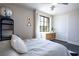 Bright bedroom with a cozy bed, modern decor, and a window with neighborhood views at 12124 Kite Hill Ln, Las Vegas, NV 89138