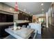 The dining area features unique pendant lighting and overlooks the gourmet kitchen at 12124 Kite Hill Ln, Las Vegas, NV 89138