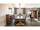Chic dining room showcasing dark wood floors, modern lighting, and a stylish buffet at 12124 Kite Hill Ln, Las Vegas, NV 89138