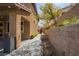 Landscaped side yard with a walking path that leads to the backyard pool area at 12124 Kite Hill Ln, Las Vegas, NV 89138