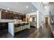 A modern kitchen with stainless appliances and a large island with bar stool seating at 12124 Kite Hill Ln, Las Vegas, NV 89138