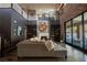 Open-concept living room with hardwood floors, fireplace, and a view of the upstairs loft area at 12124 Kite Hill Ln, Las Vegas, NV 89138