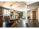 Modern, open-concept living and dining areas featuring sleek flooring and chic interior design elements at 12124 Kite Hill Ln, Las Vegas, NV 89138