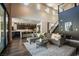 Spacious living room showcasing a seamless transition to the open kitchen and staircase at 12124 Kite Hill Ln, Las Vegas, NV 89138