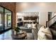 Spacious living room with hardwood floors, kitchen and access to outdoor patio at 12124 Kite Hill Ln, Las Vegas, NV 89138