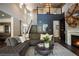 Living room featuring an open floor plan, hardwood floors, and a staircase at 12124 Kite Hill Ln, Las Vegas, NV 89138