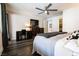The primary bedroom offers a dedicated desk space, stylish decor, and a ceiling fan at 12124 Kite Hill Ln, Las Vegas, NV 89138