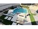 Aerial view of a luxurious pool area with comfortable seating, a fire pit, and lush landscaping, creating a perfect outdoor retreat at 12428 Lincoln Creek Ave, Las Vegas, NV 89138