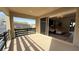 This home has a covered balcony overlooking the community and a glimpse of the pool at 12428 Lincoln Creek Ave, Las Vegas, NV 89138