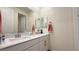 Bathroom showcasing double sinks, white countertops, and modern gold fixtures at 12428 Lincoln Creek Ave, Las Vegas, NV 89138