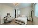 Bright bedroom featuring a desk, a light color scheme, and decorative wall shelves at 12428 Lincoln Creek Ave, Las Vegas, NV 89138
