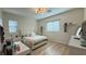 Bright bedroom with a desk, a light color scheme, and decorative wall shelves at 12428 Lincoln Creek Ave, Las Vegas, NV 89138