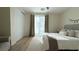 Comfortable bedroom with a large window, plush bedding, and ample closet space at 12428 Lincoln Creek Ave, Las Vegas, NV 89138