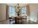 Cozy dining area features a modern light fixture, natural light, and seating for four at 12428 Lincoln Creek Ave, Las Vegas, NV 89138