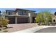 Beautiful two-story home featuring a brick driveway and attached two-car garage at 12428 Lincoln Creek Ave, Las Vegas, NV 89138
