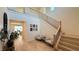 Bright foyer with staircase, hardwood floors, and stylish decor at 12428 Lincoln Creek Ave, Las Vegas, NV 89138