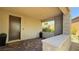Inviting covered front porch featuring brick flooring and stone accents at 12428 Lincoln Creek Ave, Las Vegas, NV 89138