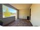 Inviting covered porch features brick flooring and offers a welcoming entry at 12428 Lincoln Creek Ave, Las Vegas, NV 89138