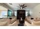 Bright and airy living room features modern furnishings and a sleek entertainment center at 12428 Lincoln Creek Ave, Las Vegas, NV 89138