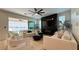 Spacious living room with modern furnishings, fireplace, and sliding glass doors to the patio at 12428 Lincoln Creek Ave, Las Vegas, NV 89138