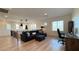Upstairs open floorplan featuring a cozy sofa, desk area and modern lighting at 12428 Lincoln Creek Ave, Las Vegas, NV 89138