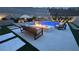 Backyard swimming pool with lounge, fire pit and manicured landscaping at 12428 Lincoln Creek Ave, Las Vegas, NV 89138