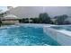 Inviting pool with waterfalls and a spa, surrounded by lush landscaping, offering a tranquil retreat at 12428 Lincoln Creek Ave, Las Vegas, NV 89138