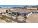 Aerial view of desert home with covered back patio, desert landscaping, and block wall at 12720 Davis Wright Ct, Henderson, NV 89044