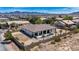 Aerial view of home with a tile roof, desert landscaping, block wall, and covered patio at 12720 Davis Wright Ct, Henderson, NV 89044