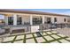 The backyard features a large covered patio, string lights, and low-maintenance desert landscaping at 12720 Davis Wright Ct, Henderson, NV 89044