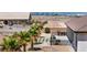 A spacious backyard patio features an outdoor grill and ample seating, perfect for entertaining at 12720 Davis Wright Ct, Henderson, NV 89044