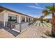 A spacious backyard showcases a covered patio, desert landscaping, and a synthetic grass installation at 12720 Davis Wright Ct, Henderson, NV 89044