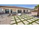 A spacious backyard showcases a covered patio, desert landscaping, and a synthetic grass installation at 12720 Davis Wright Ct, Henderson, NV 89044