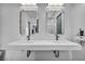 This bathroom features a double sink and decorative mirrors at 12720 Davis Wright Ct, Henderson, NV 89044