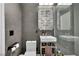 Contemporary bathroom featuring mosaic tile in shower, modern fixtures, and stylish vanity with artistic accents at 12720 Davis Wright Ct, Henderson, NV 89044