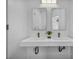 Elegant bathroom with a double sink vanity and a sleek mirror providing a clean and modern aesthetic at 12720 Davis Wright Ct, Henderson, NV 89044